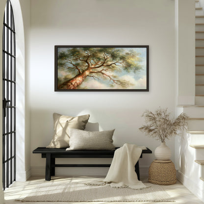 Majestic tree canopy painting framed canvas wall art in an entryway above a bench