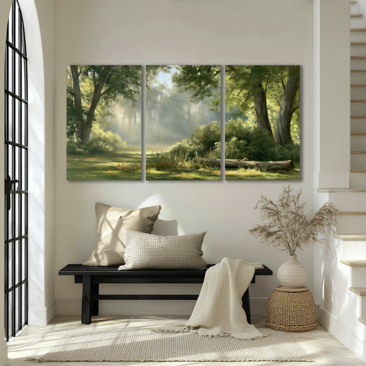 Sunlit forest glade painting 3 piece canvas wall art in an entryway above a bench