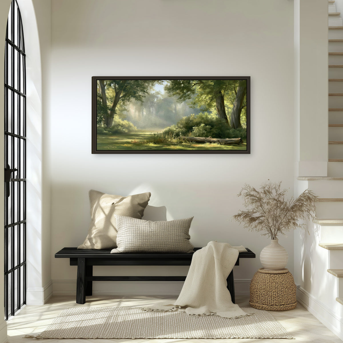 Sunlit forest glade painting framed canvas wall art in an entryway above a bench