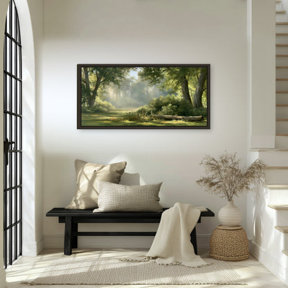 Sunlit forest glade painting framed canvas wall art in an entryway above a bench