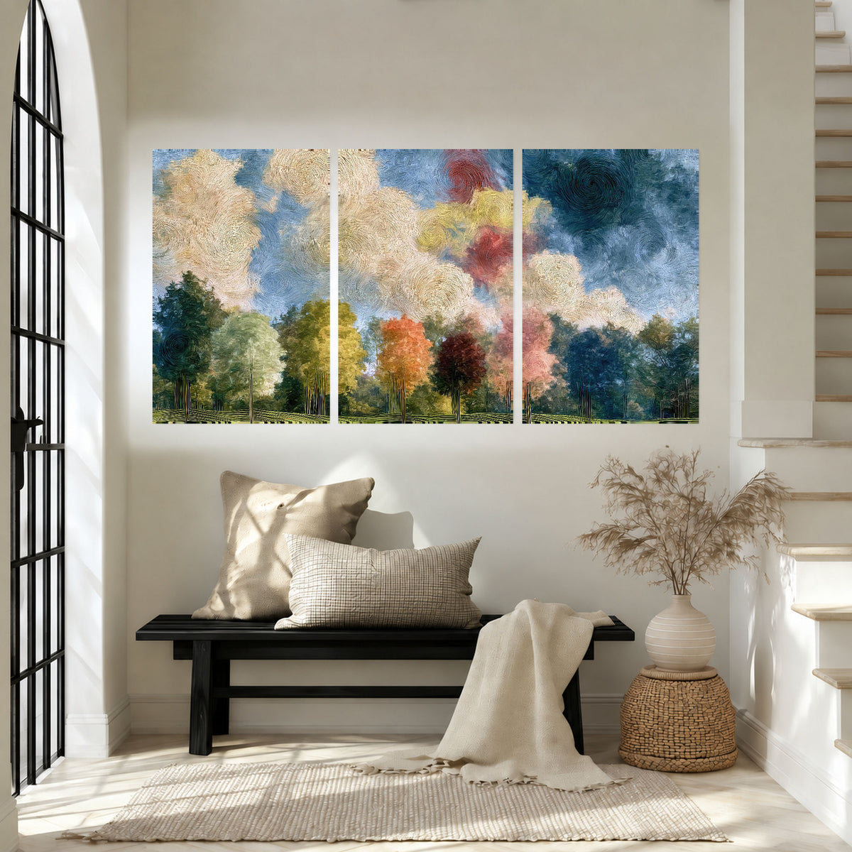 Swirling sky tree painting set of 3 poster prints in an entryway above a bench