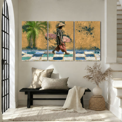 Surfer street painting 3 piece canvas wall art in an entryway above a bench