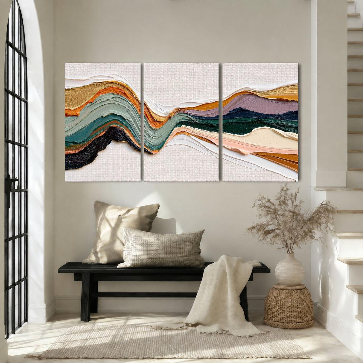 Textured abstract waves painting 3 piece canvas wall art in an entryway above a bench