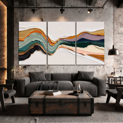 Textured abstract waves painting 3 piece canvas wall art in an industrial loft