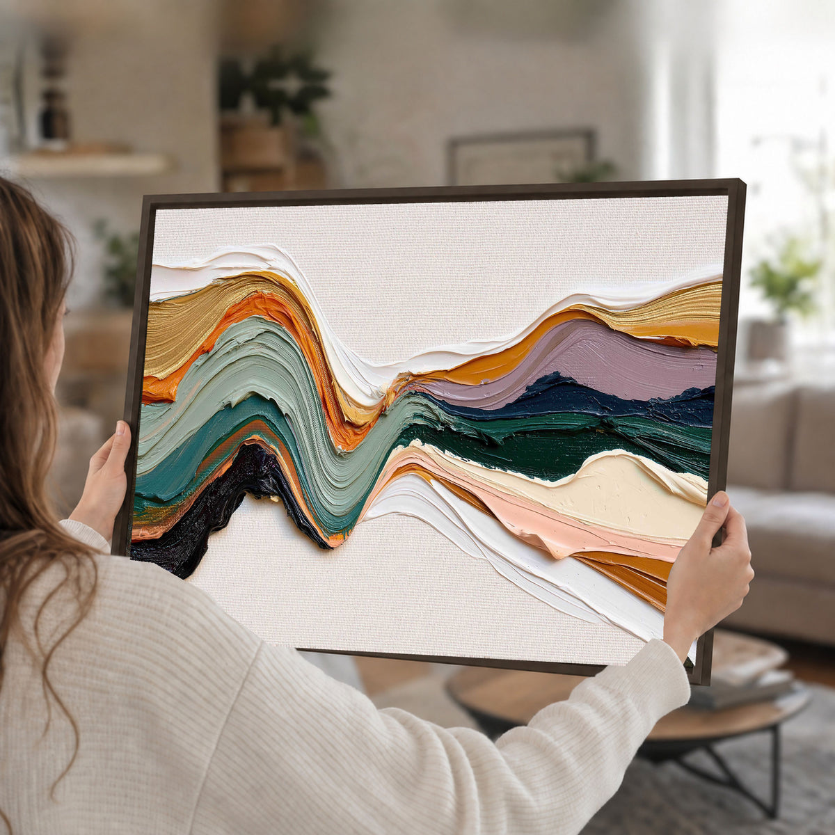 Textured abstract waves painting framed canvas wall art held in hands