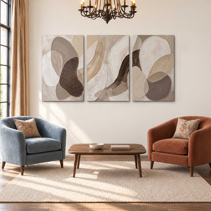 Layered organic shapes in taupe, cream and brown 3 piece canvas wall art styled in an interior