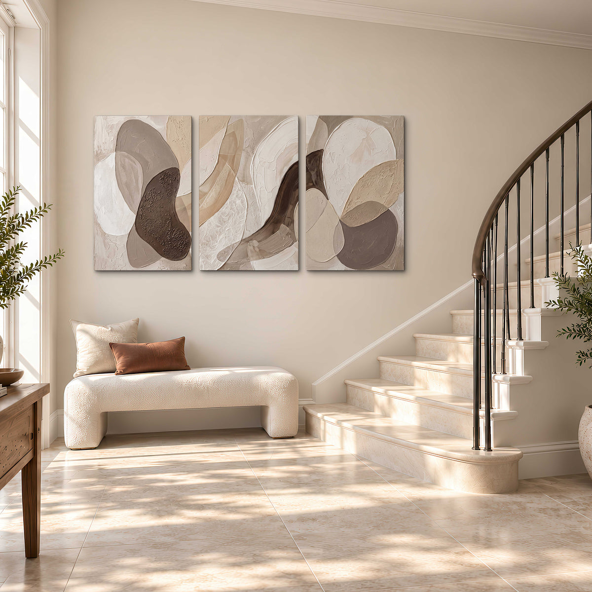 Layered organic shapes in taupe, cream and brown 3 piece canvas wall art styled in an interior