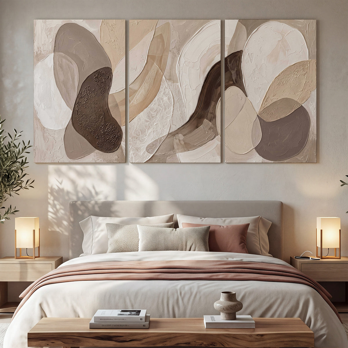 Layered organic shapes in taupe, cream and brown 3 piece canvas wall art displayed in a bedroom