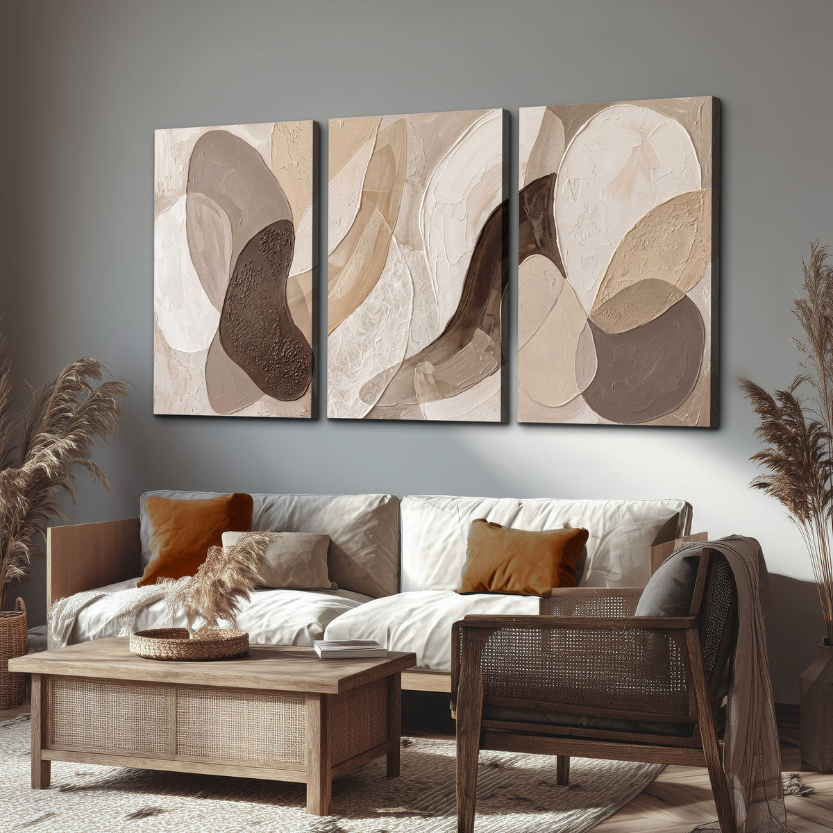 Layered organic shapes in taupe, cream and brown 3 piece canvas wall art displayed in a rustic living room