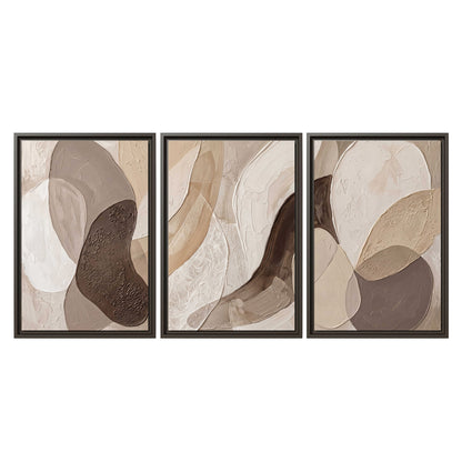Layered organic shapes in taupe, cream and brown 3 piece framed canvas wall art viewed straight on