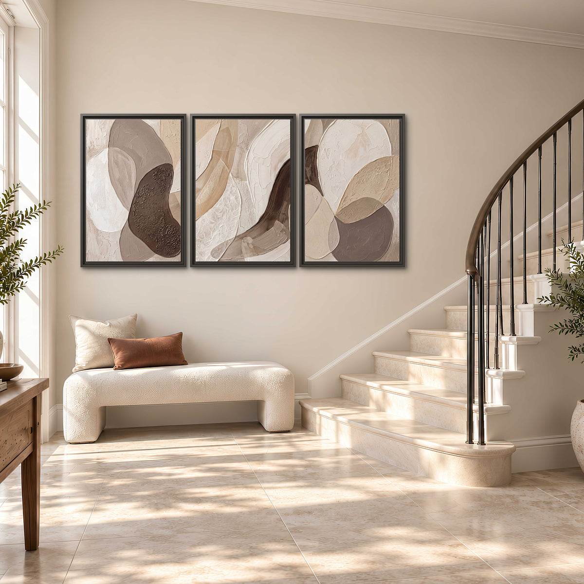 Layered organic shapes in taupe, cream and brown 3 piece framed canvas wall art styled in an interior