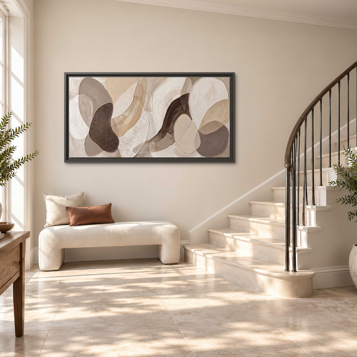 Layered organic shapes in taupe, cream and brown single framed canvas wall art styled in an interior