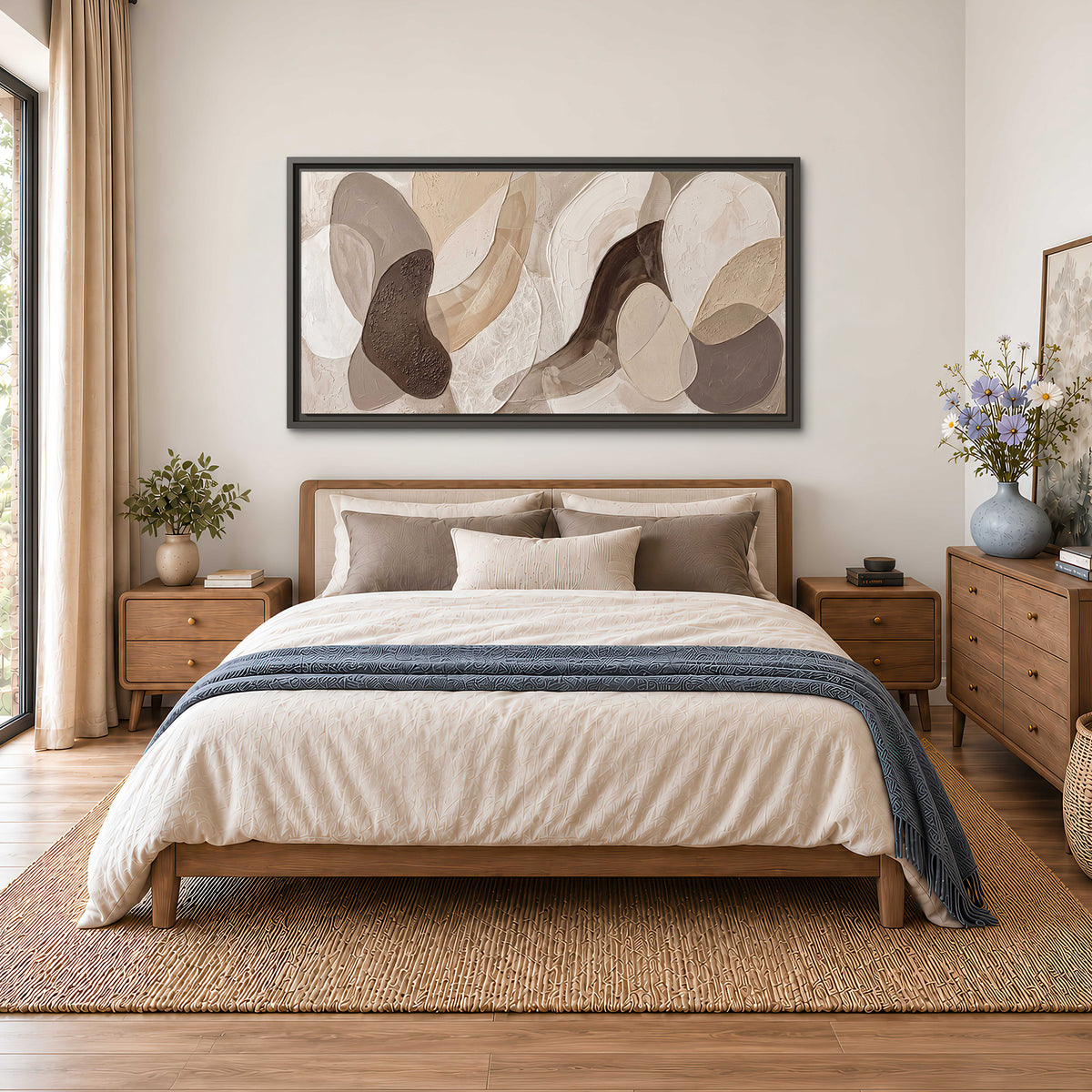 Layered organic shapes in taupe, cream and brown single framed canvas wall art styled in an interior