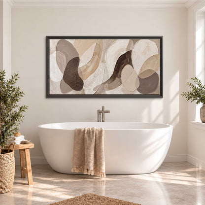Layered organic shapes in taupe, cream and brown single framed canvas wall art styled in an interior