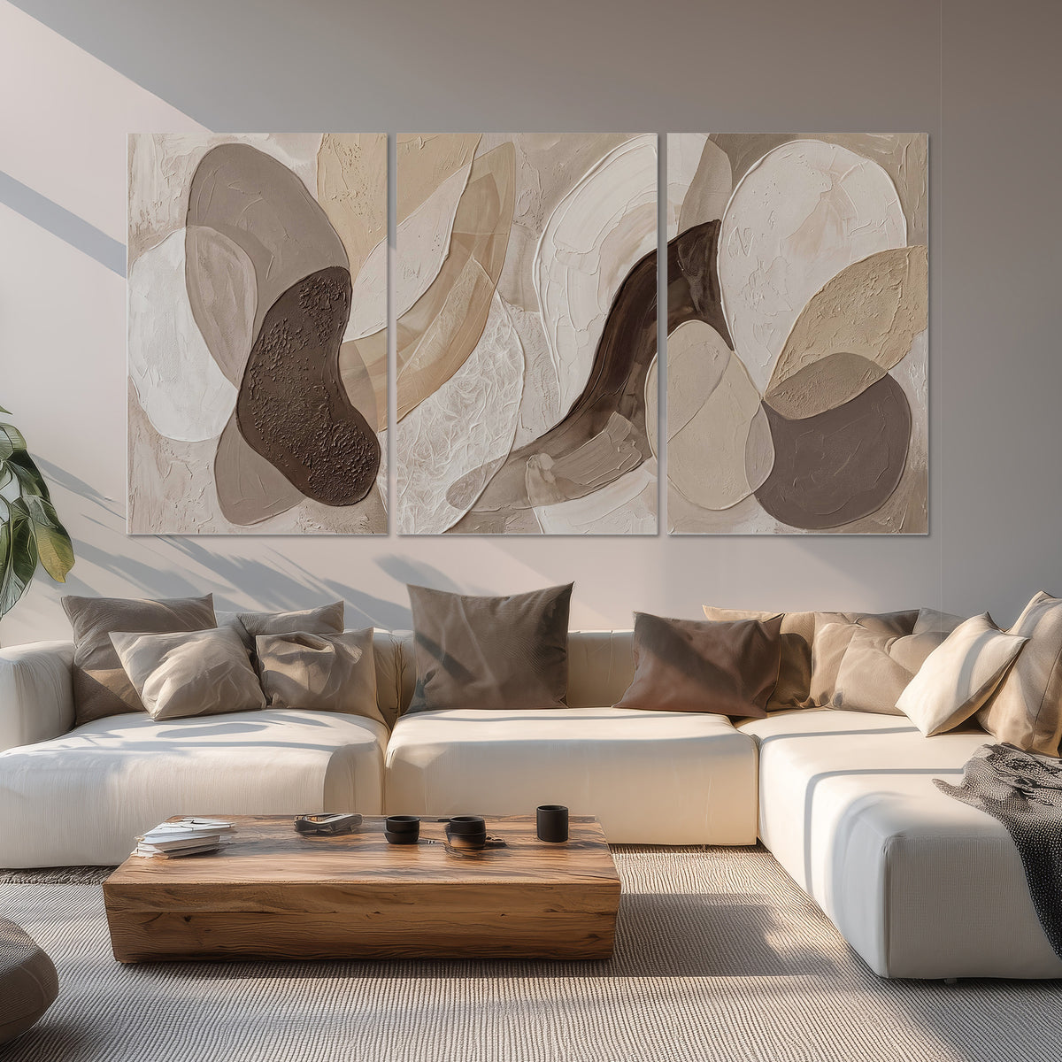 Layered organic shapes in taupe, cream and brown set of 3 poster prints displayed in a living room