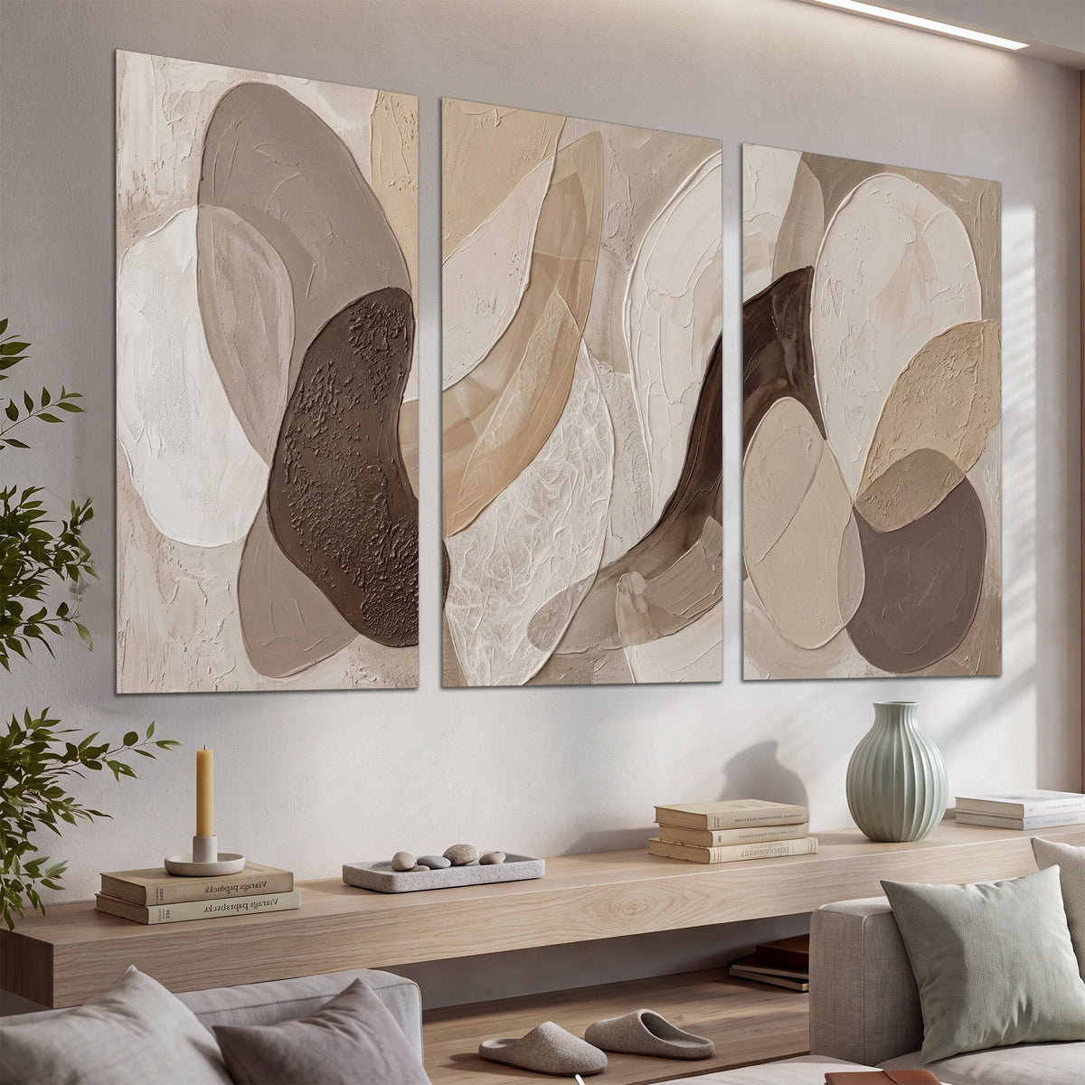 Layered organic shapes in taupe, cream and brown set of 3 poster prints displayed in a console