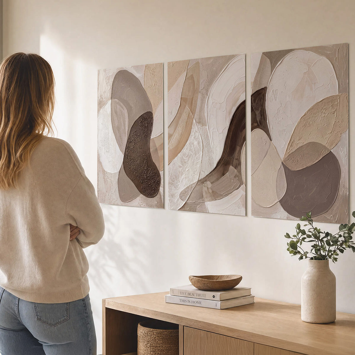 Layered organic shapes in taupe, cream and brown set of 3 poster prints three panel arrangement on a wall