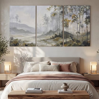 Misty woodland stream with gray trees, muted olive foliage and distant hazy hills 3 piece canvas wall art displayed in a bedroom