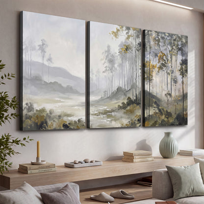 Misty woodland stream with gray trees, muted olive foliage and distant hazy hills 3 piece canvas wall art displayed in a console