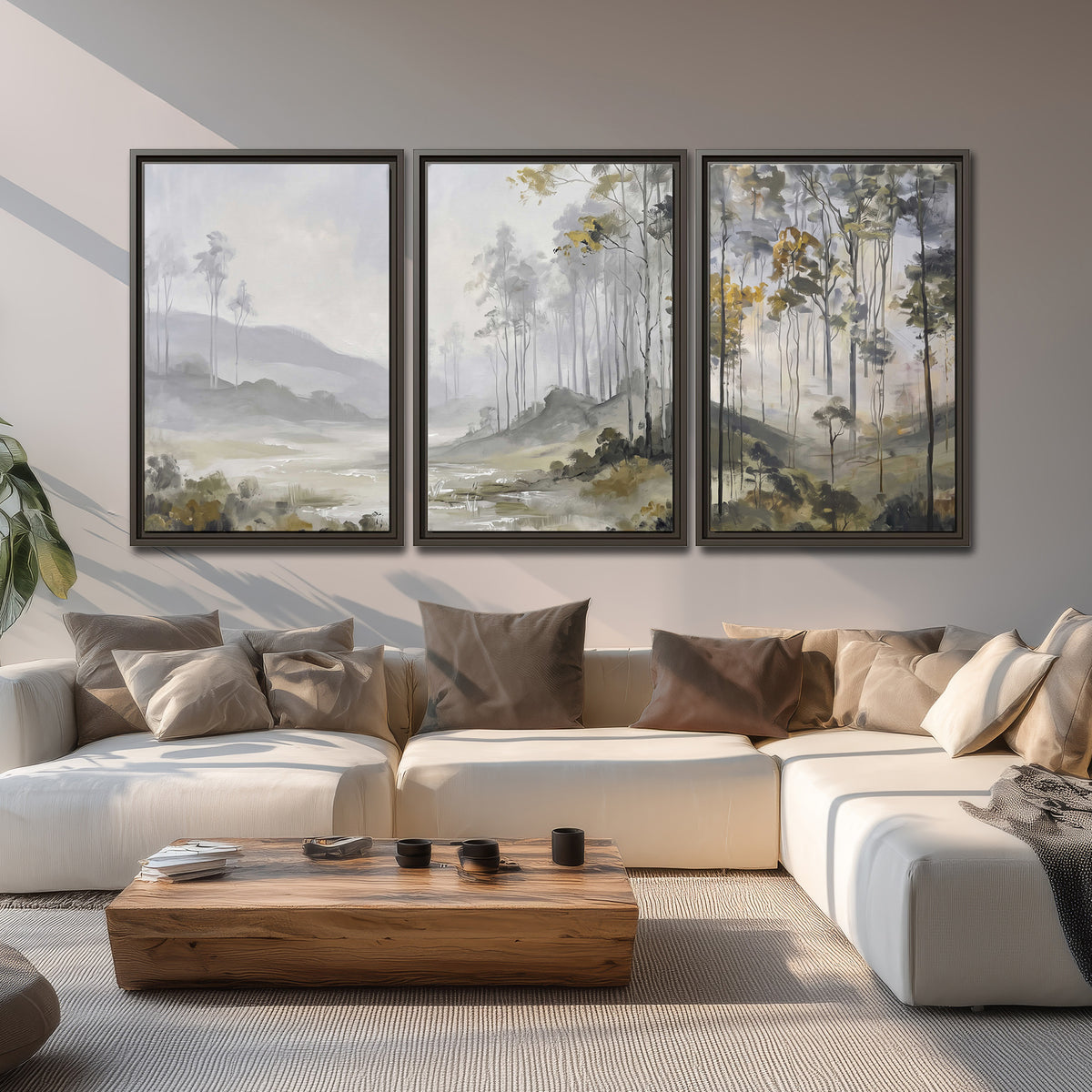 Misty woodland stream with gray trees, muted olive foliage and distant hazy hills 3 piece framed canvas wall art displayed in a living room