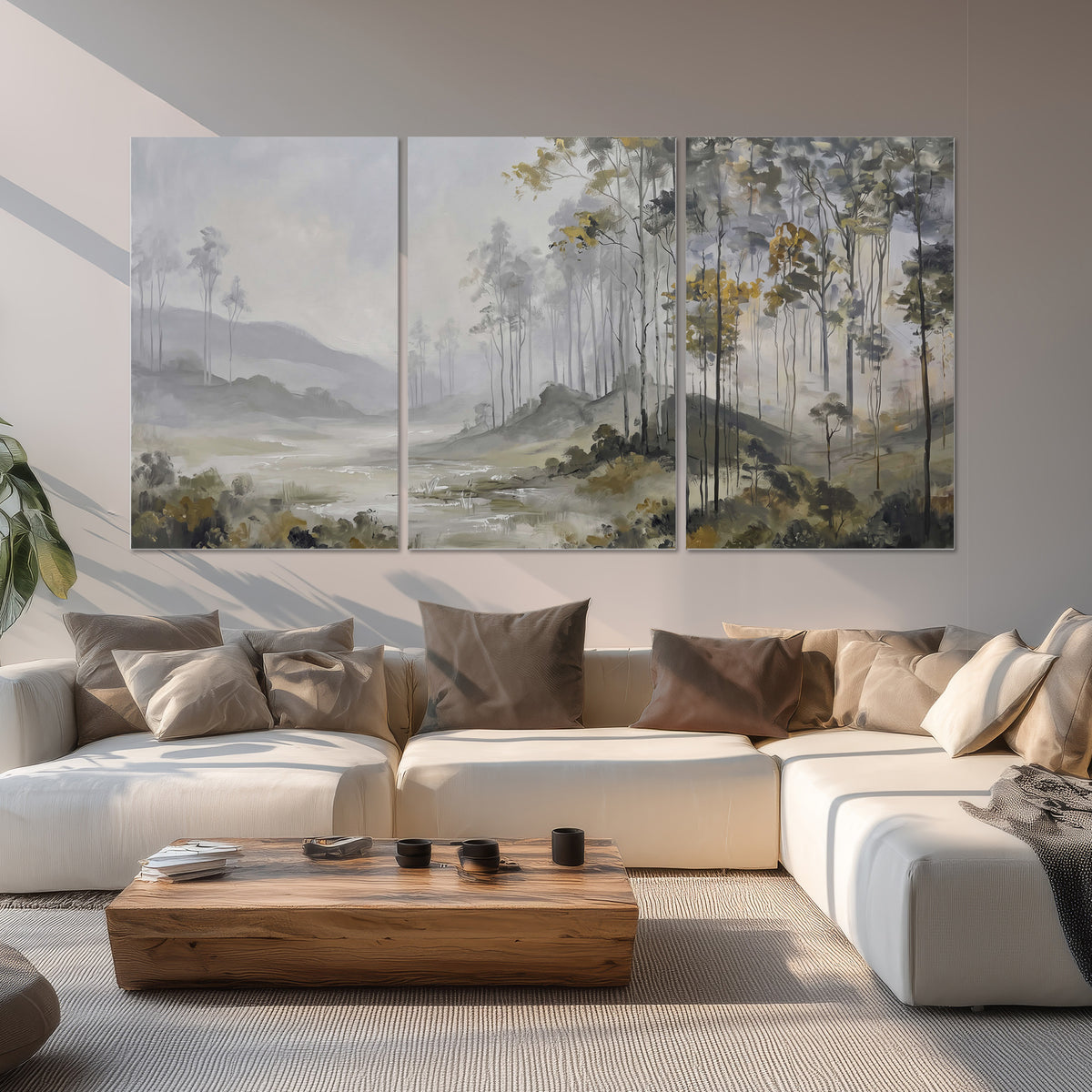 Misty woodland stream with gray trees, muted olive foliage and distant hazy hills set of 3 poster prints displayed in a living room