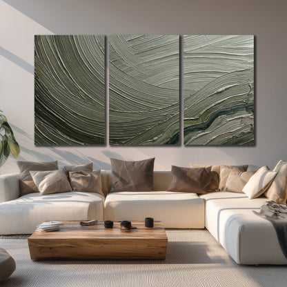 Olive and sage green abstract flowing waves with curved painted-style ridges 3 piece canvas wall art displayed in a living room