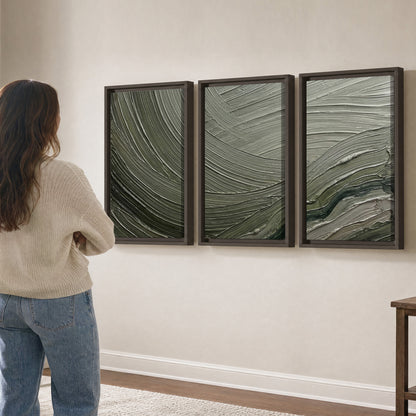 Olive and sage green abstract flowing waves with curved painted-style ridges 3 piece framed canvas wall art three panel arrangement on a wall