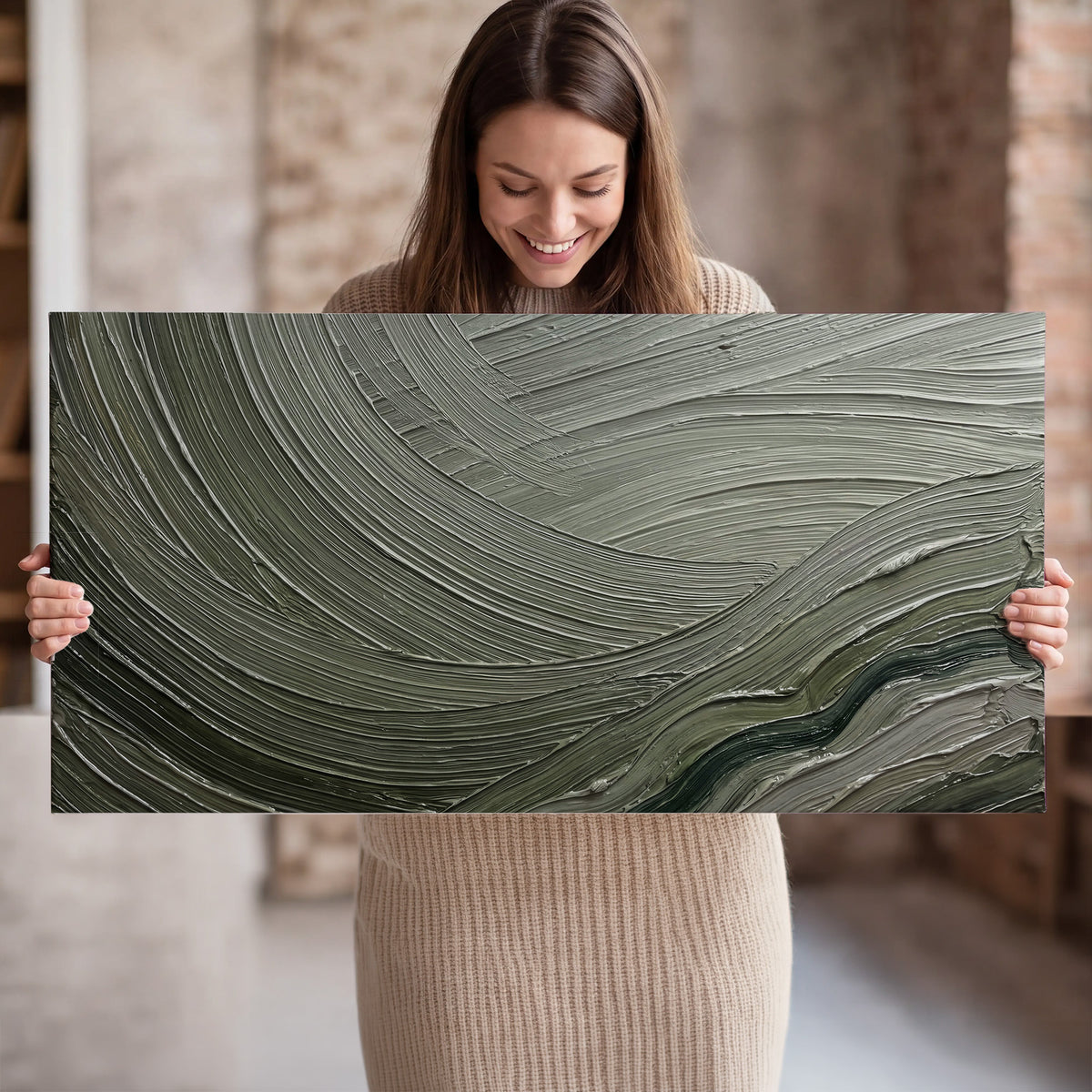 Olive and sage green abstract flowing waves with curved painted-style ridges single canvas wall art held in hands