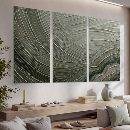 Olive and sage green abstract flowing waves with curved painted-style ridges set of 3 poster prints displayed in a console