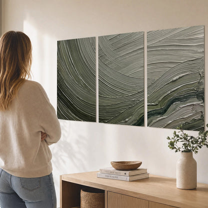 Olive and sage green abstract flowing waves with curved painted-style ridges set of 3 poster prints three panel arrangement on a wall