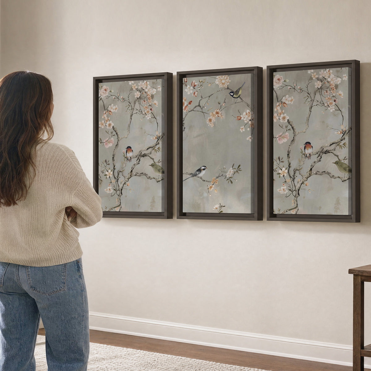 Small songbirds among pink and cream blossoms, green leaves and delicate branches on gray 3 piece framed canvas wall art three panel arrangement on a wall