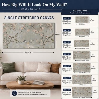 Small songbirds among pink and cream blossoms, green leaves and delicate branches on gray single canvas wall art size guide above a sofa; room view is illustrative