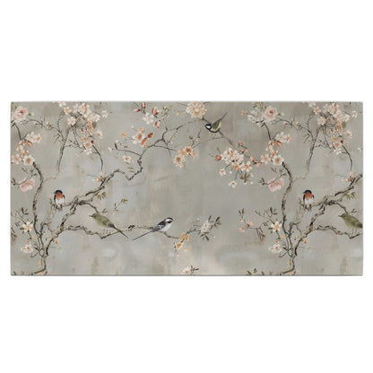 Small songbirds among pink and cream blossoms, green leaves and delicate branches on gray single canvas wall art viewed straight on