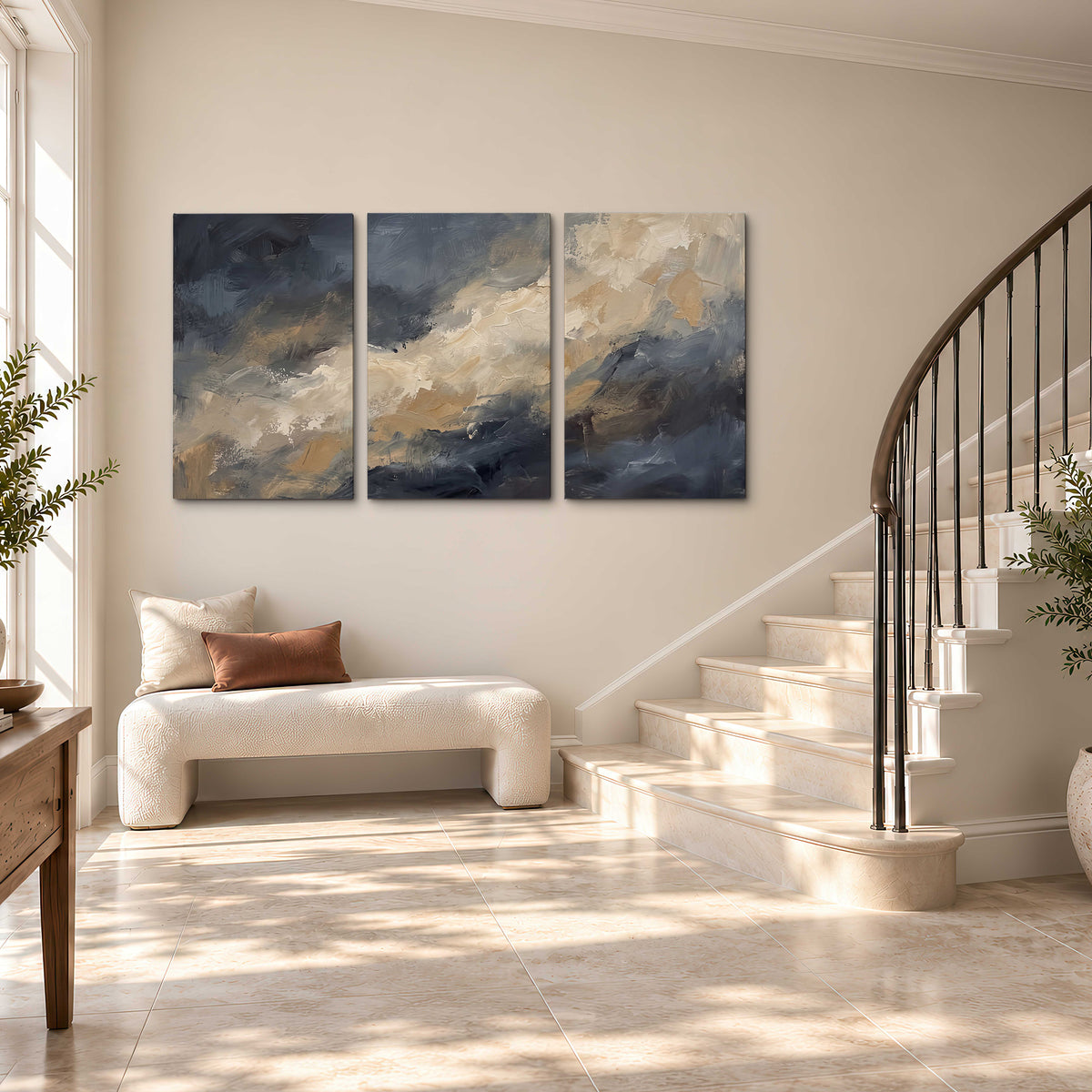 Sweeping charcoal and cream painted clouds with warm gold tones 3 piece canvas wall art styled in an interior