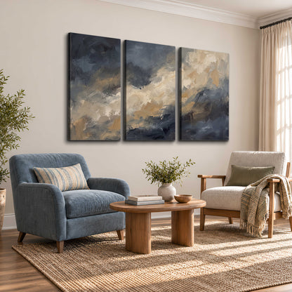 Sweeping charcoal and cream painted clouds with warm gold tones 3 piece canvas wall art styled in an interior