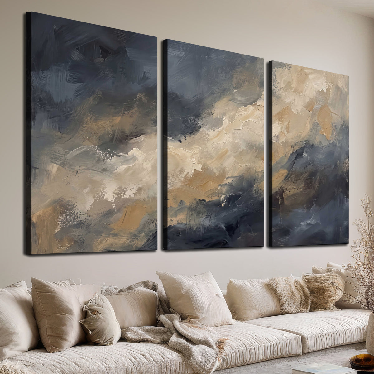 Sweeping charcoal and cream painted clouds with warm gold tones 3 piece canvas wall art room and product view