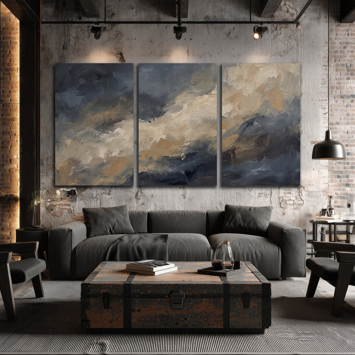 Sweeping charcoal and cream painted clouds with warm gold tones 3 piece canvas wall art displayed in a industrial room