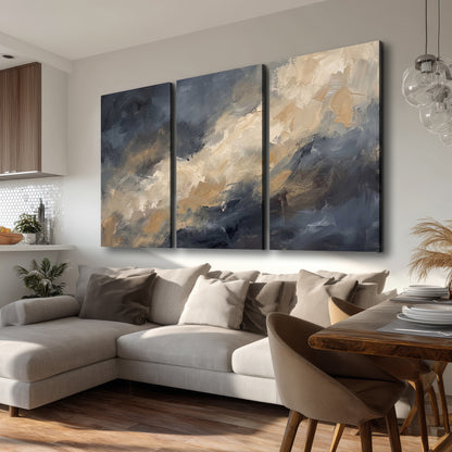 Sweeping charcoal and cream painted clouds with warm gold tones 3 piece canvas wall art room and product view