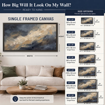Sweeping charcoal and cream painted clouds with warm gold tones single framed canvas wall art size guide above a sofa; room view is illustrative