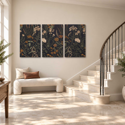 Small cream and rust flowers on a dark botanical background 3 piece canvas wall art styled in an interior