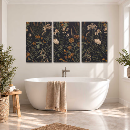 Small cream and rust flowers on a dark botanical background 3 piece canvas wall art styled in an interior