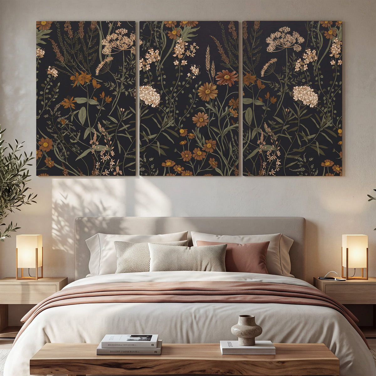 Small cream and rust flowers on a dark botanical background 3 piece canvas wall art displayed in a bedroom