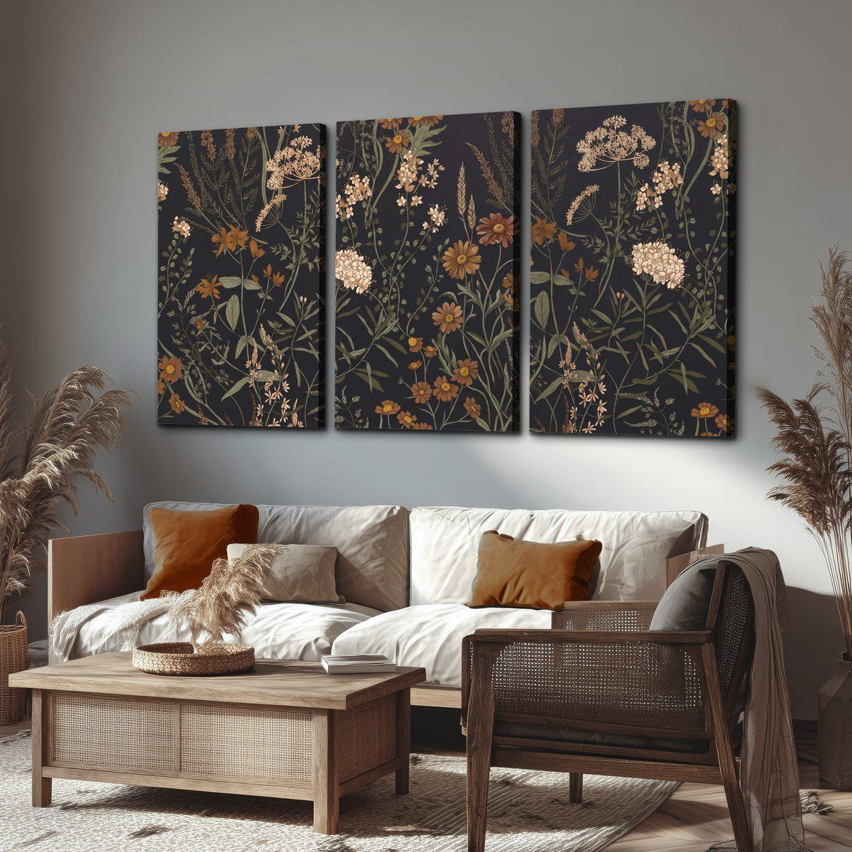Small cream and rust flowers on a dark botanical background 3 piece canvas wall art displayed in a rustic living room