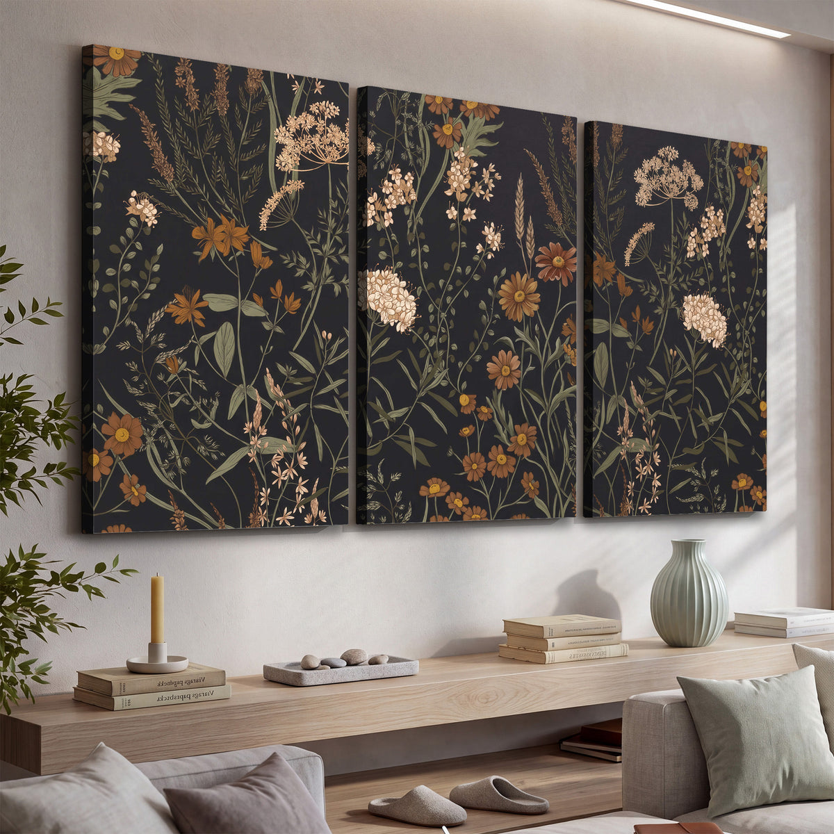 Small cream and rust flowers on a dark botanical background 3 piece canvas wall art displayed in a console