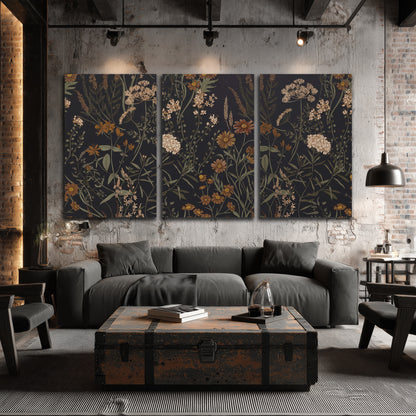 Small cream and rust flowers on a dark botanical background 3 piece canvas wall art displayed in a industrial room