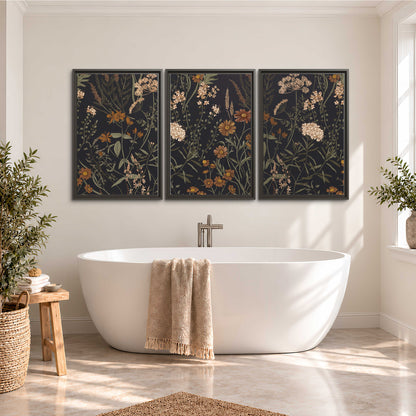 Small cream and rust flowers on a dark botanical background 3 piece framed canvas wall art styled in an interior