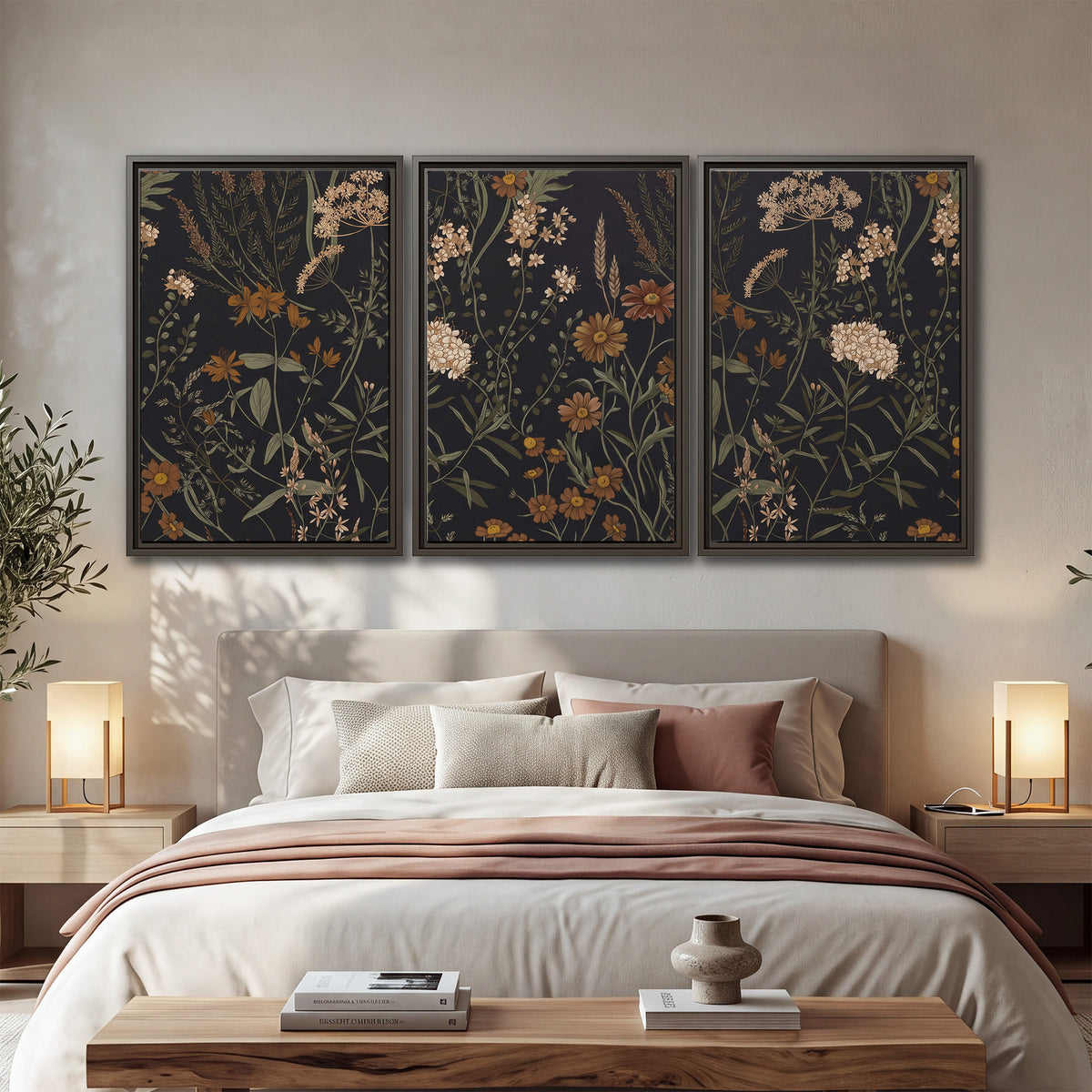 Small cream and rust flowers on a dark botanical background 3 piece framed canvas wall art displayed in a bedroom