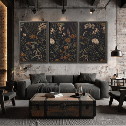 Small cream and rust flowers on a dark botanical background 3 piece framed canvas wall art displayed in a industrial room