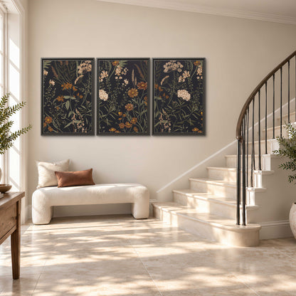 Small cream and rust flowers on a dark botanical background 3 piece framed canvas wall art styled in an interior