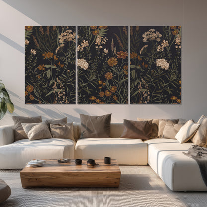 Small cream and rust flowers on a dark botanical background set of 3 poster prints displayed in a living room